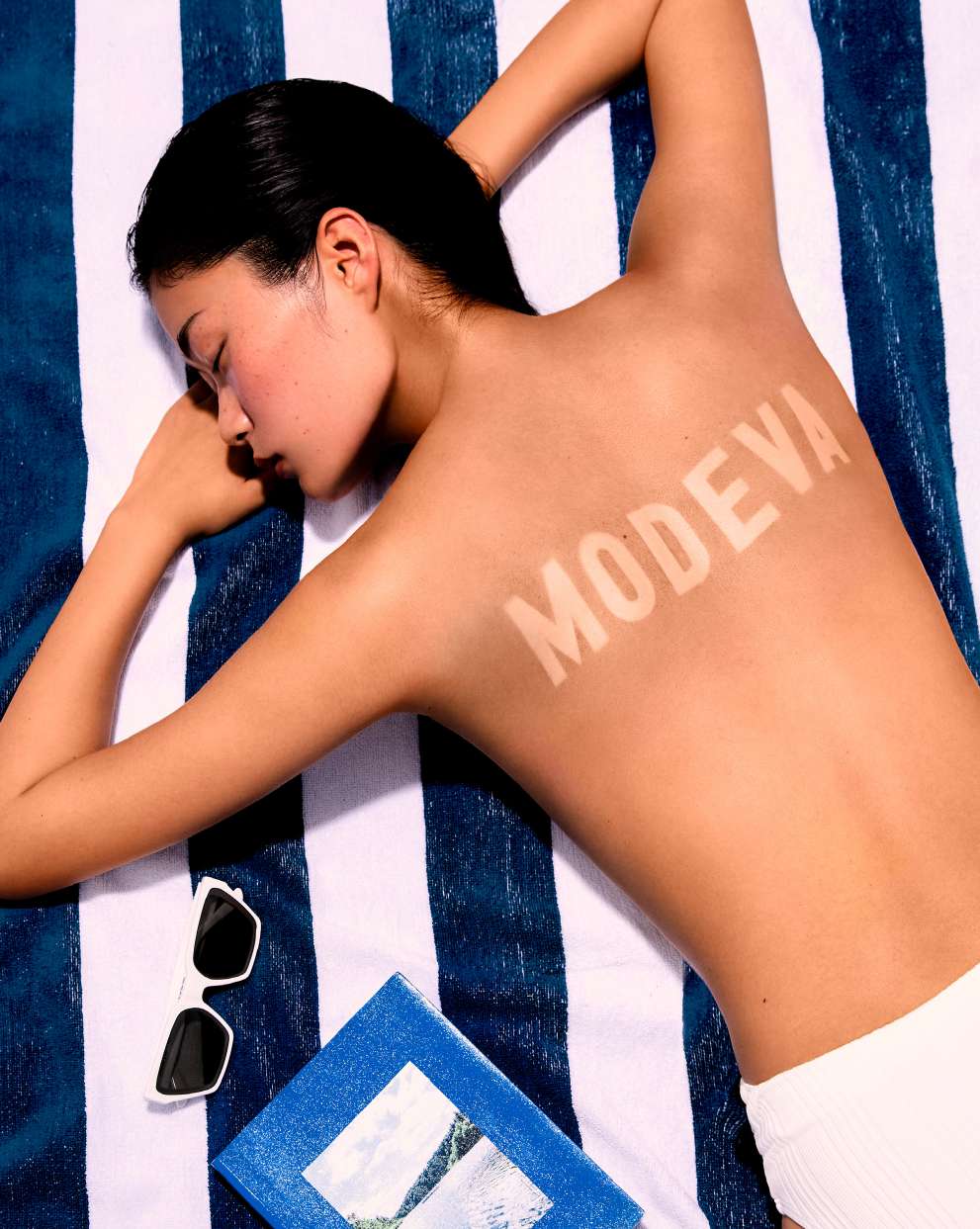Sunbather with The Modeva branding