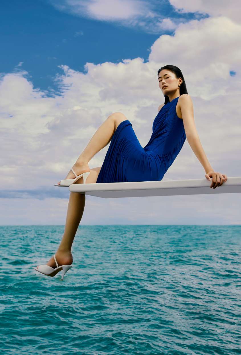 Diver above turquoise water — The Modeva brand imagery